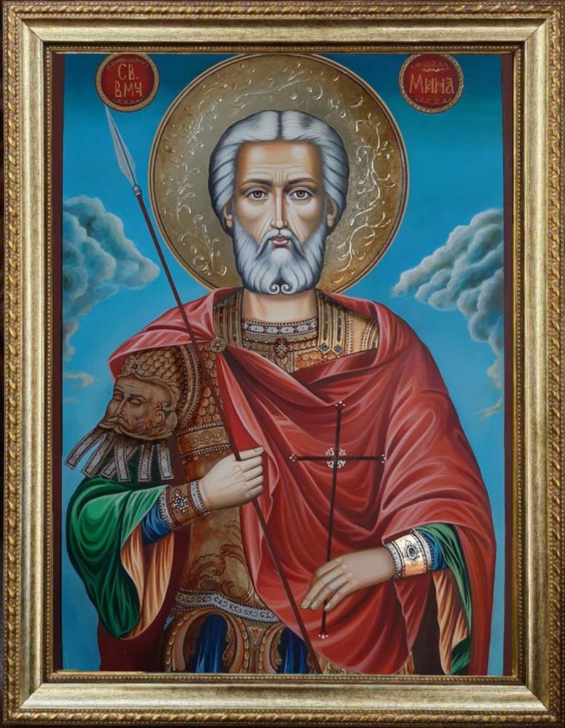 Religious wooden icon of Saint Mina with detailed sacred symbolism