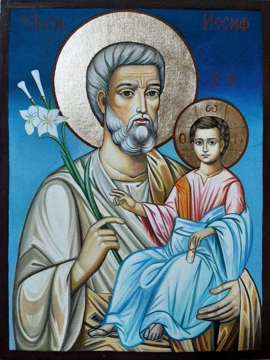 Saint Joseph holding baby Jesus in Orthodox icon
