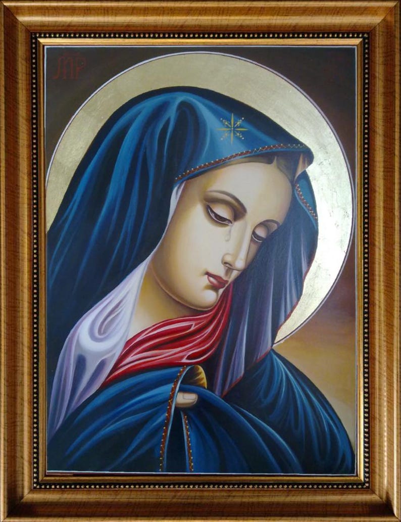Close-up of Eleusa-style Weeping Madonna icon showing gold leaf and fine ornamentation on wooden board