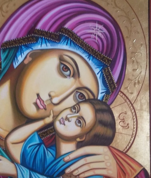 Orthodox Christian icon of the Mother of God holding Jesus – traditional religious art on wood